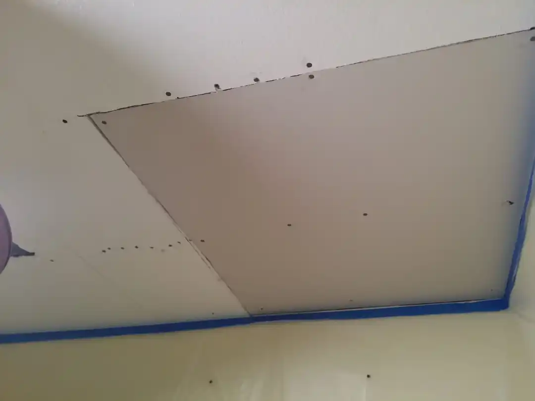 Air movers and dehumidifiers drying out a water-damaged room