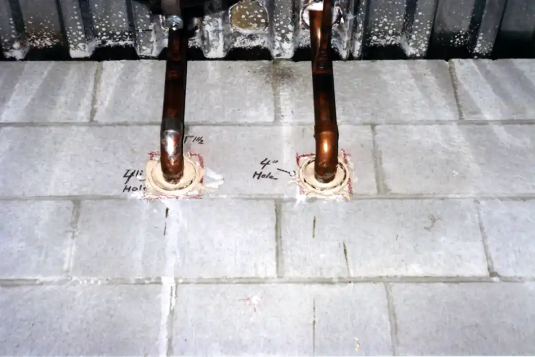 Copper water piping where lines enter a wall