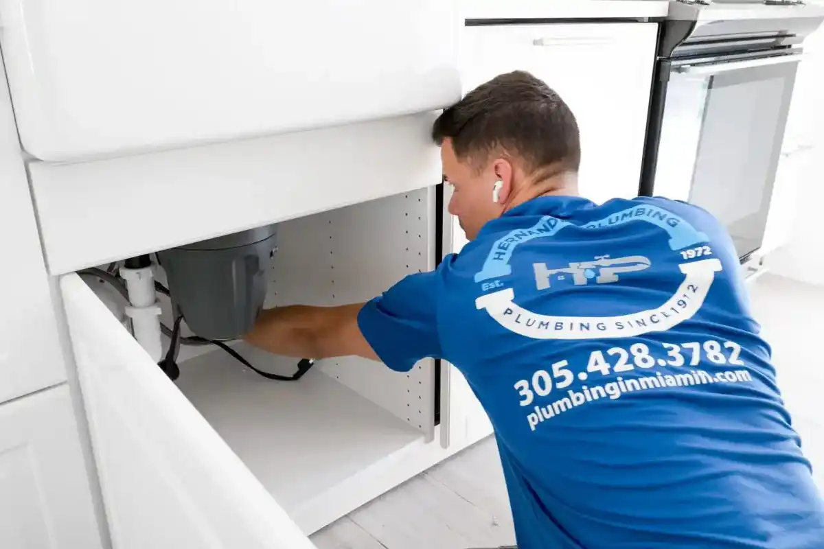 Hernandez Plumbing technician working on residential plumbing service equipment.