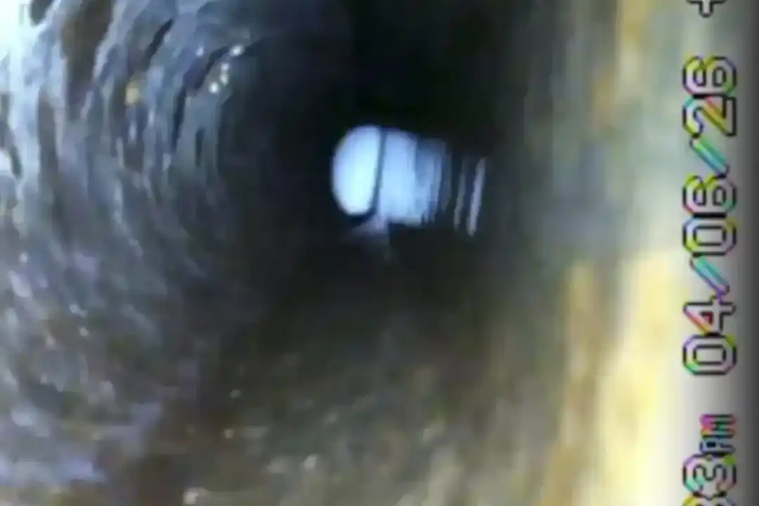 Sewer-camera view used to document conditions inside an older line