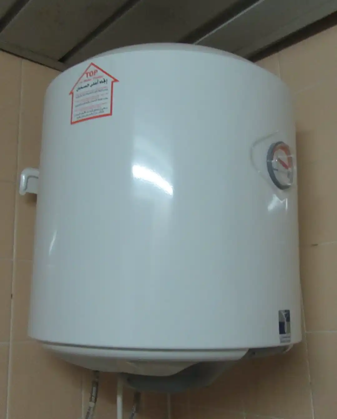 Tank-style residential water heater in a utility space