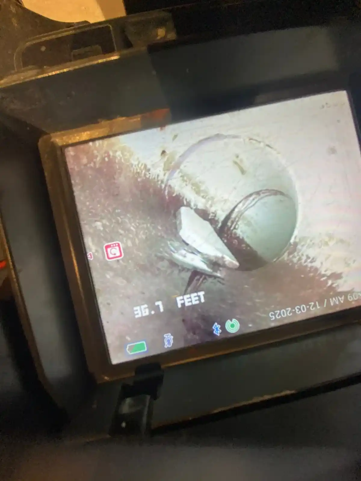 Drain camera inspection equipment documenting blockage conditions in a sewer line