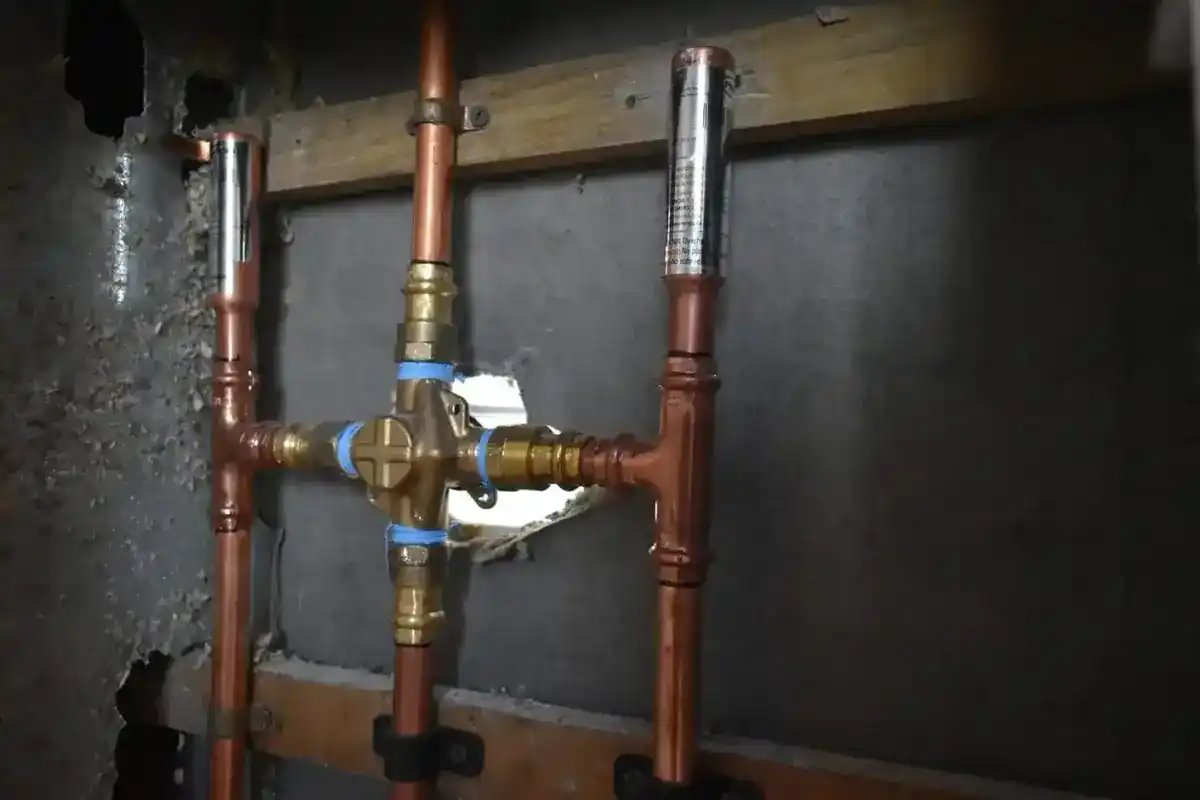 New copper water lines and a valve installed during a residential water-line replacement project