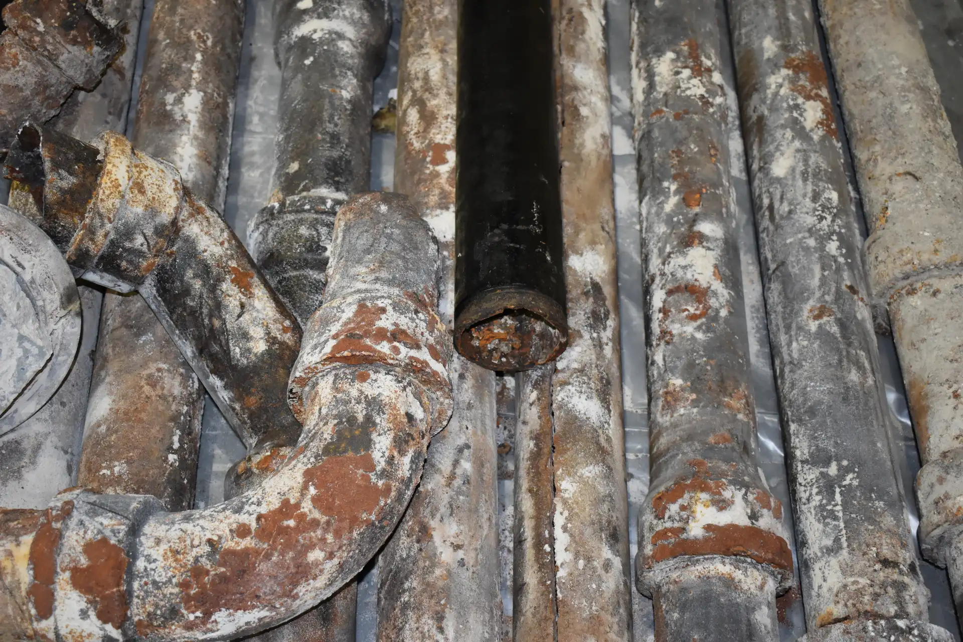 Corroded sewer pipes removed after a sewer camera inspection identified severe damage