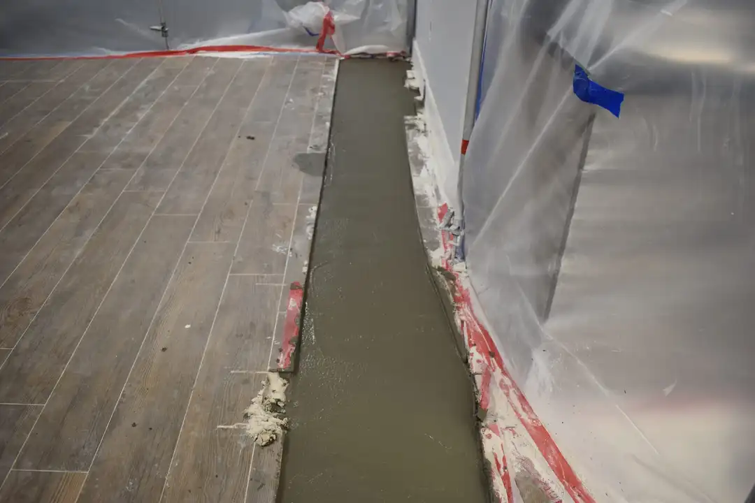 Concrete restoration after cast iron pipe replacement under slab