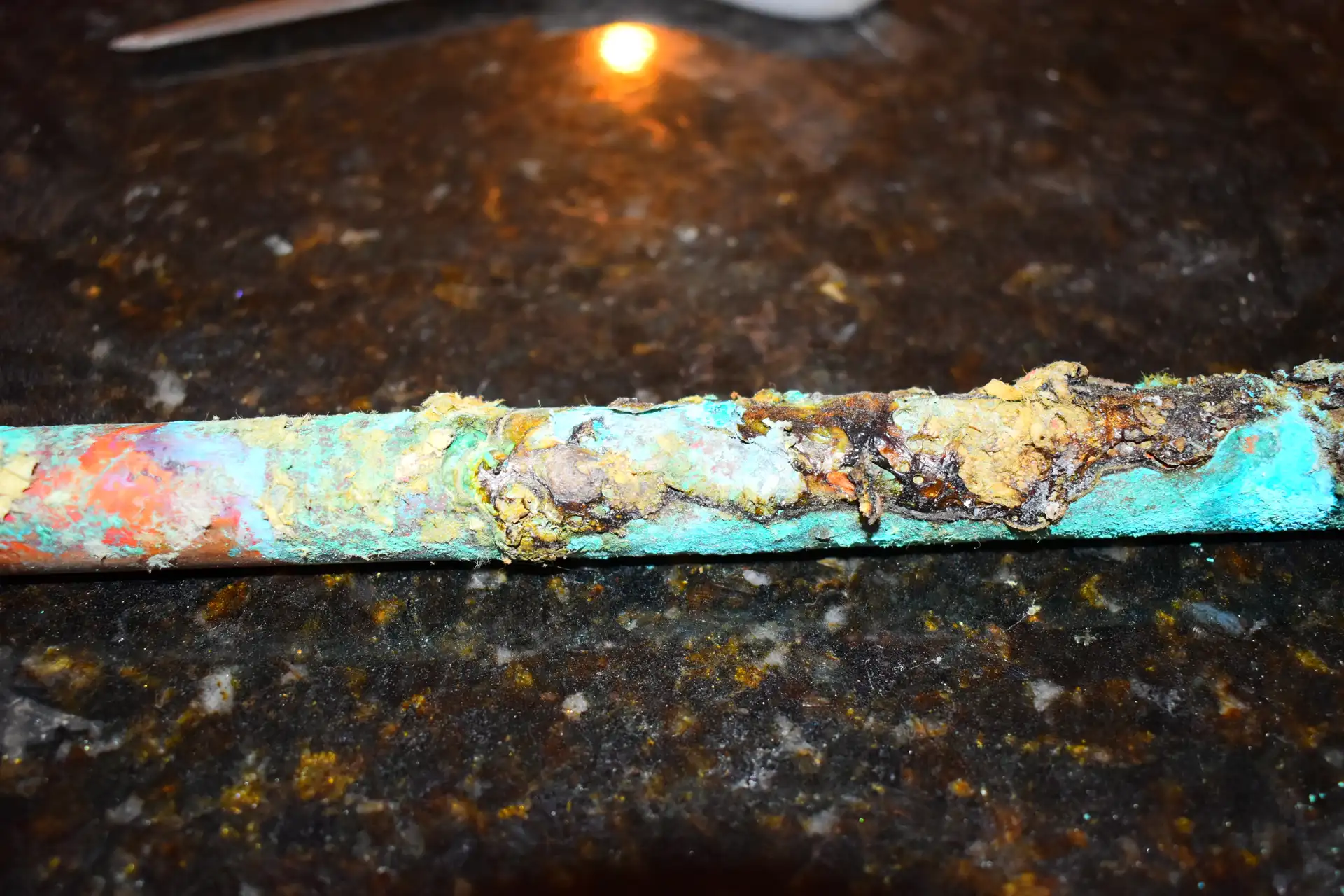 Severely rusted pipes in commercial building before replacement