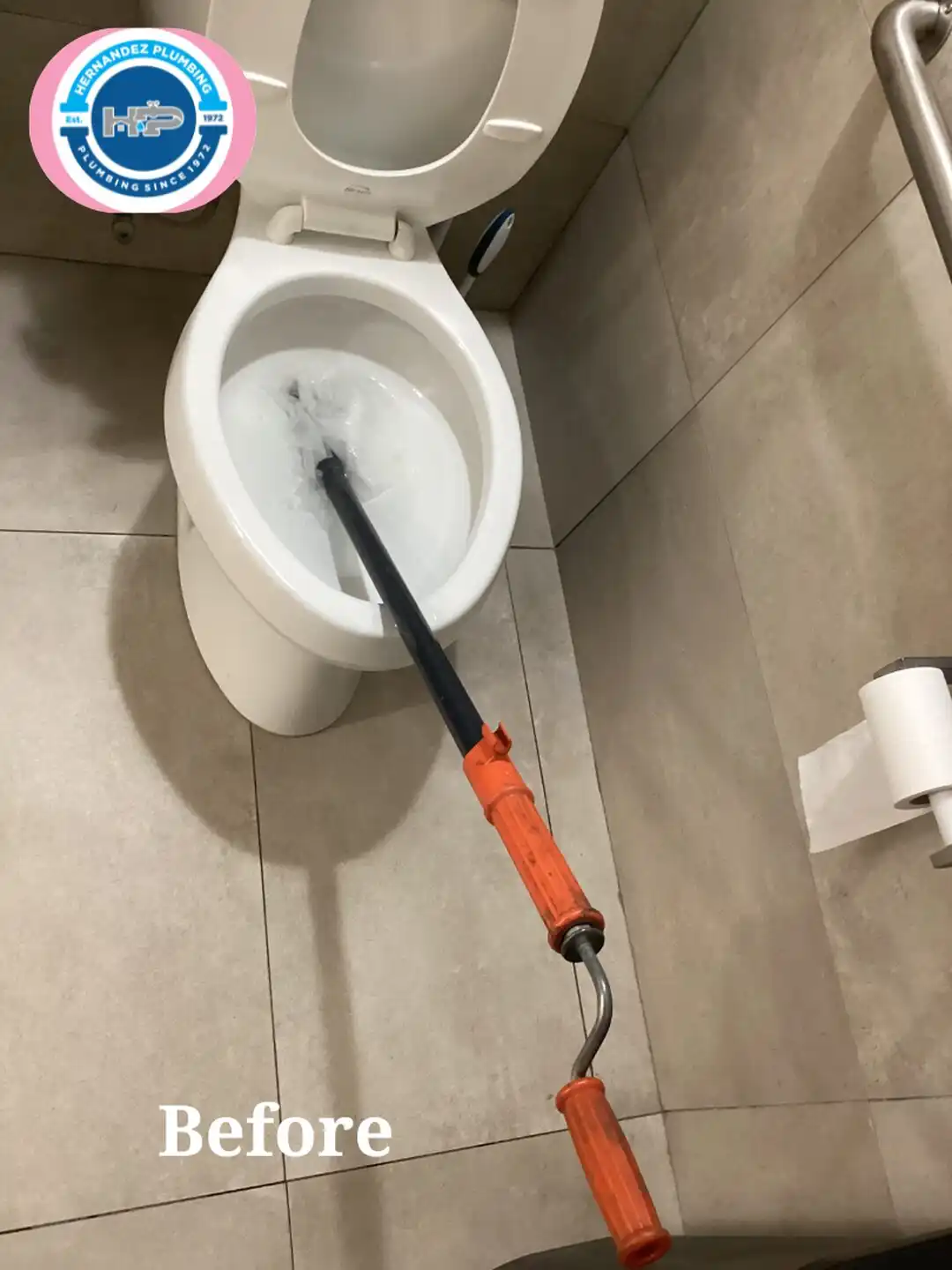 Before photo: Hernandez Plumbing snaking a clogged toilet in a Cutler Bay restroom.