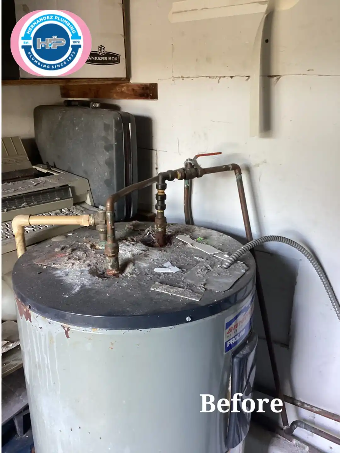 Before photo: old American ProLine electric water heater in a home utility room.