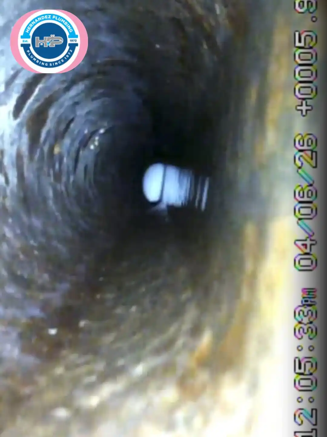Sewer camera inspection inside a cast-iron drain line.